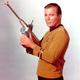 Actor William Shatner posing with the phaser rifle designed by Reuben Klamer for Star Trek.